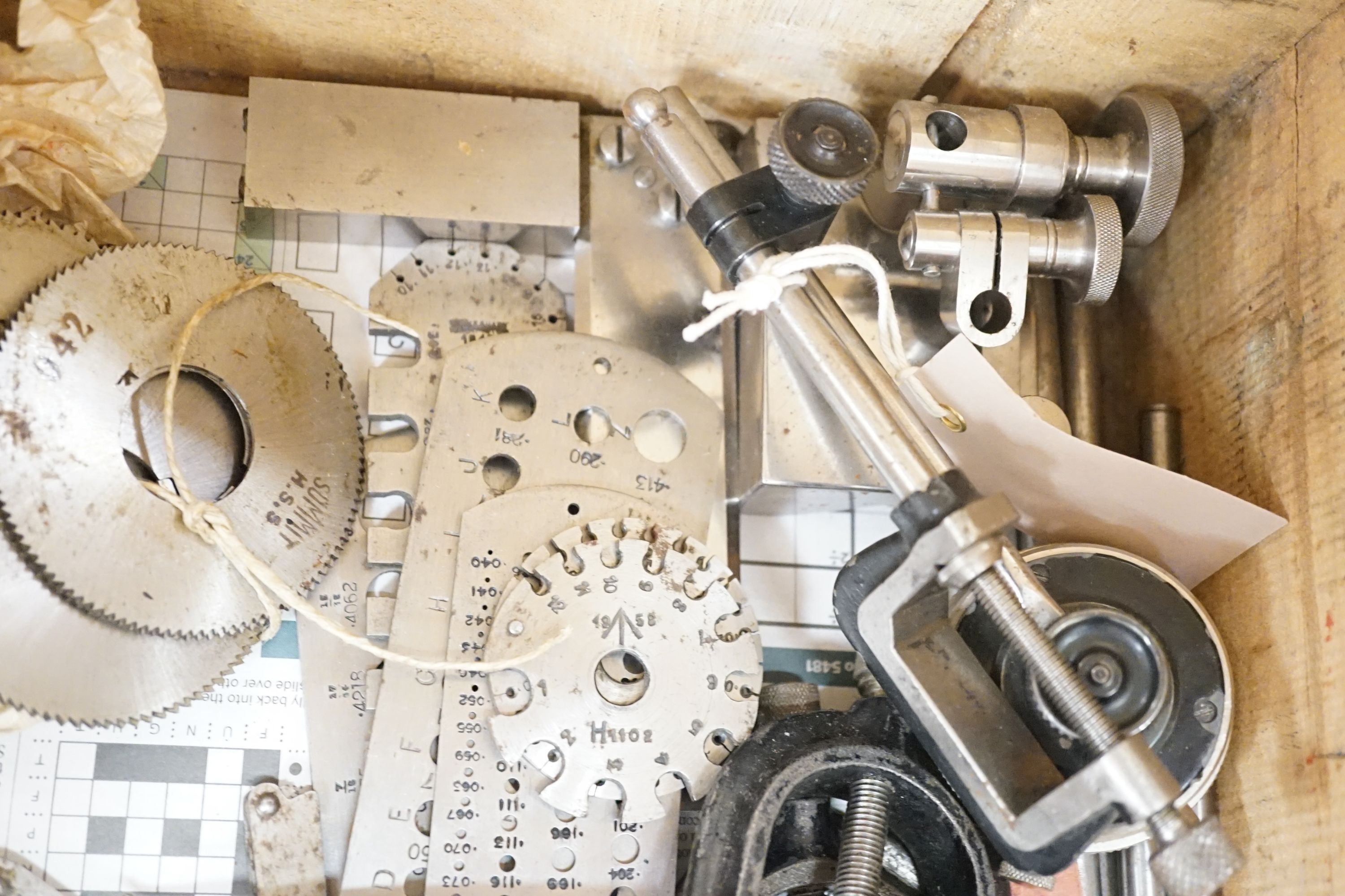 A collection of 20th century high precision metal measuring devices, including callipers, Compac dial micrometers, feeler gauges, wire gauges, a set square, steel cutting wheels etc